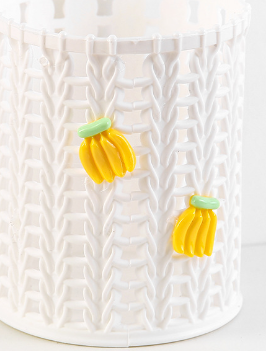 Vit pennhållare med bananmotiv