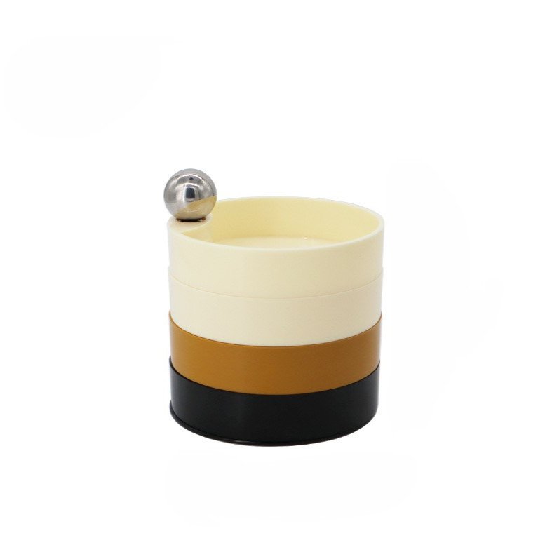 Smyckeskrin i beige, senapsgult och svart